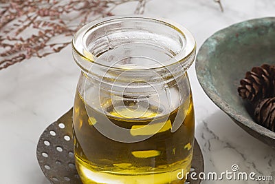 Natural olive oil concept in glass cup Stock Photo