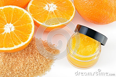 Natural orange sugar lip scrub on white. Stock Photo