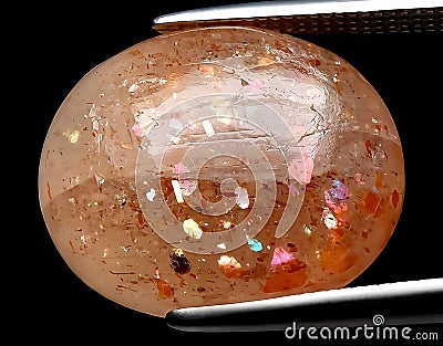 natural orange sunstone gem on the background Stock Photo