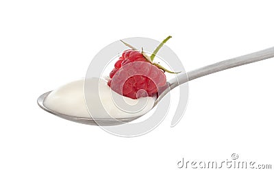 Natural organic yoghurt, yoghourt on spoon with raspberry. Stock Photo