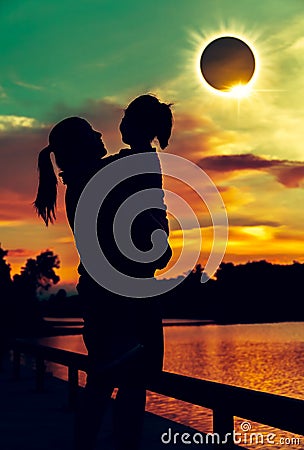 Natural phenomenon. Mother and daughter looking at solar eclipse Stock Photo