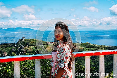 Natural portrait Beautiful Asian girl smiling. Asian woman on top of the mountain peak. summer hiking Stock Photo