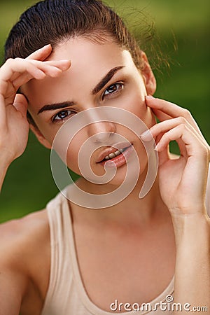 Natural portrait of a beautiful girl with pure skin outdoors Stock Photo