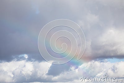 Natural rainbow in the cloudy sky Stock Photo