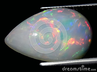 natural rainbow multi color opal gem on the background Stock Photo