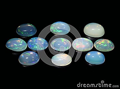 natural rainbow multi color opal gem on the background Stock Photo