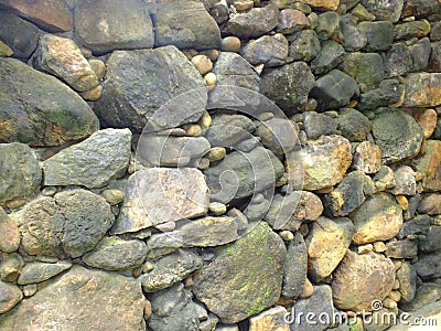 Natural rocks and stones arrange as wall artistic pattern Stock Photo