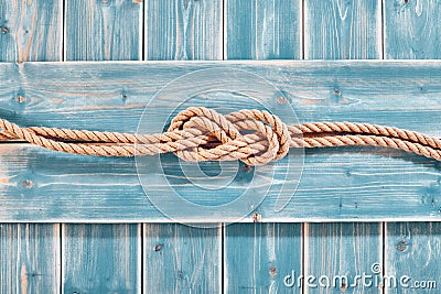 Natural Rope Double Figure Eight Knot on Blue Wood Stock Photo