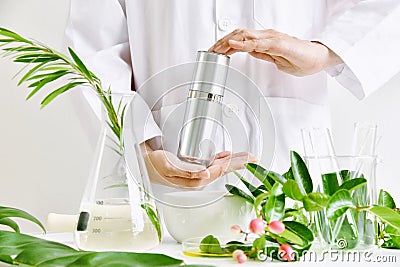 Natural skincare beauty product research, Green organic herbal essence discovery at science lab. Stock Photo