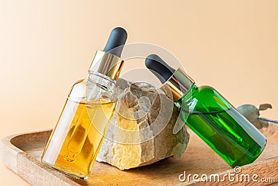 Natural skincare product in glass bottles with dropper. Serum for woman facial skin. Herbal mineral cosmetic, vitamin body oil on Stock Photo