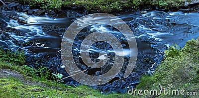 Natural Slow falling water and long exposure Waterfall in Rural Creek Stock Photo