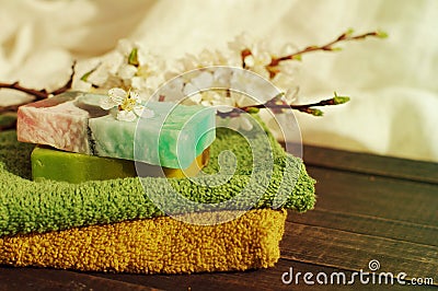 Natural soap of handwork, towel, and spring branches of an apricot Stock Photo