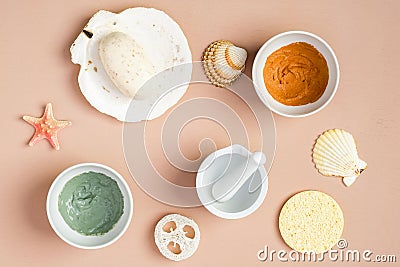 Natural SPA cosmetics for skincare, body and hair care concept. Top view clay masks, homemade soap, loofah and sponge Stock Photo