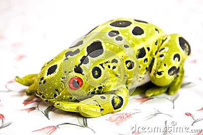 Natural style frog animal toys in a floral design cloth Stock Photo