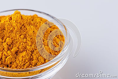 Natural turmeric powder on white acrylic background Stock Photo