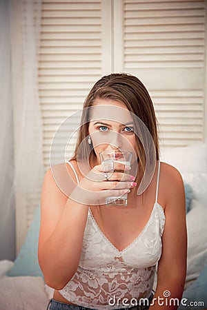 Natural woman portrait in a cozy vintage place drinking coffee close-up Stock Photo