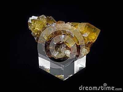 Natural yellow fluorite mineral on black background Stock Photo