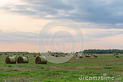 Nature background. Bales of straw on the autumn meadow during wonderful sunset times Stock Photo