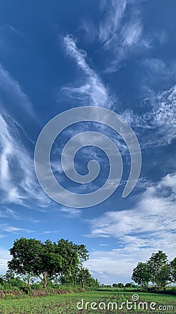 Bright clouds and blue skies 9:16 vertical wallpaper Stock Photo