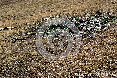 Nature contaminated by glass metal plastic waste - Pollution Stock Photo