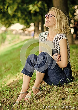 Nature inspiring environment. Girl carefree student worker laptop relaxing outdoors sit green grass. United with nature Stock Photo