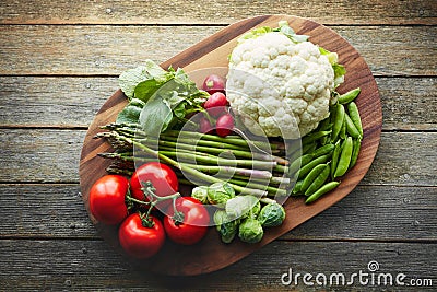 Nature knows best. a variety of fresh produce on a wooden chopping board. Stock Photo