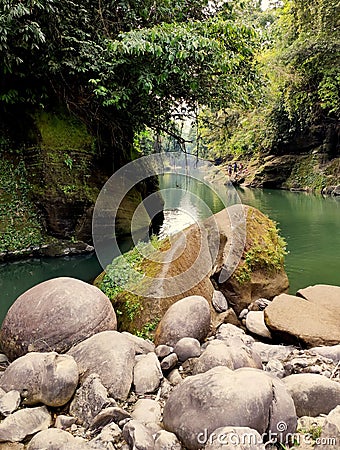 Nature landscape mountains valley hills rocks cave and blue water stream river rocks stone Stock Photo