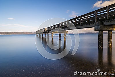 Nature landscapes of trestle bridge Dash point Pier with long exposure shot. Stock Photo