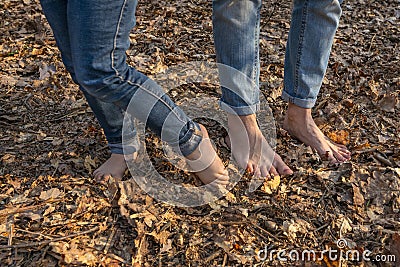 Nature massage. Barefoot foots on forest ground. Shoeless human legs at nature Stock Photo