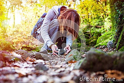 Nature photography. Photographer woman in the forest woods. Stock Photo