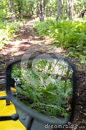 Nature reflecting in the miror of an atv Stock Photo