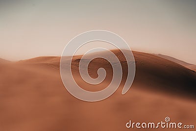 Intricate patterns sculpted by wind upon the desert sands, a captivating display of rhythmic curves and Stock Photo