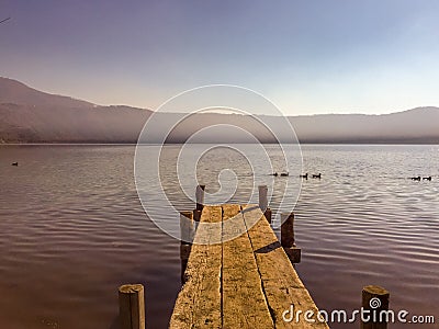 Boardwalk, Wooden Boat Jetty going out into Lake Stock Photo