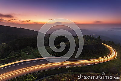 Nature sunrise background amazing curve road and twilight color long exposure view. Popular travel Mountain in Thailand Stock Photo