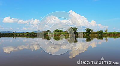 Nature symbol of arrow to right, made by white clouds on blue ba Stock Photo