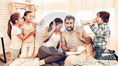 Naughty Children Annoying Parents Reading Books Stock Photo