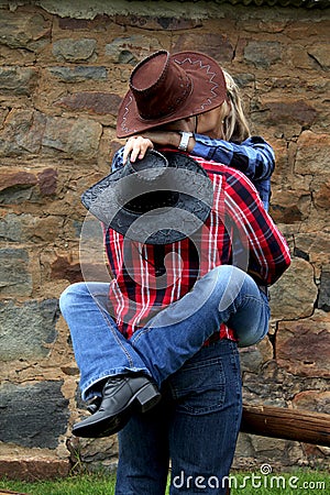 Naughty cowgirl kiss Stock Photo