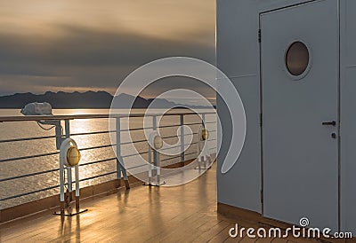 Nautical cruise ship deck lighting metal and brass exterior fixtures. Stock Photo