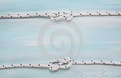 Nautical maritime wooden background in blue color with rope. Stock Photo