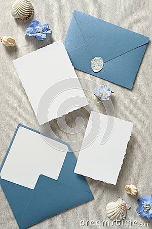 Nautical save the date cards mockups, blue envelopes, seashell on beige background. Wedding invitation card templates. Flat lay, Stock Photo