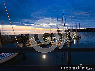 Nautical Scenery of Boats by the Dock at Sunset Stock Photo