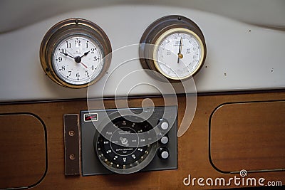 Nautical yacht cockpit. Close-up of a motorboat control panel with tachometer, fuel gage and switches Stock Photo