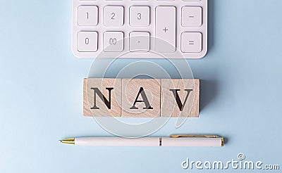 NAV on wooden cubes with pen and calculator, financial concept Stock Photo