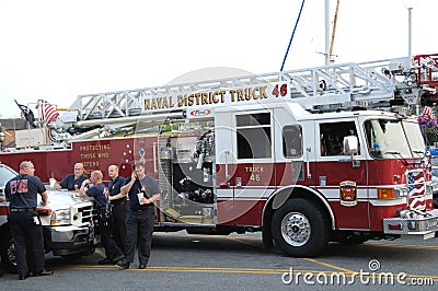 A Naval District Fire Truck and its firefighters Editorial Stock Photo