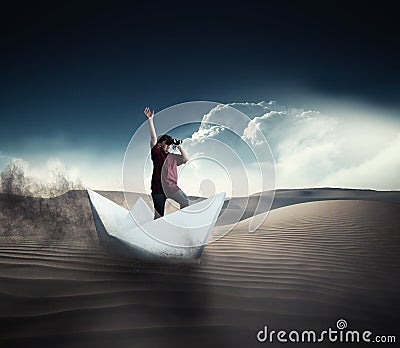 Navigate in the desert on paper boat Stock Photo