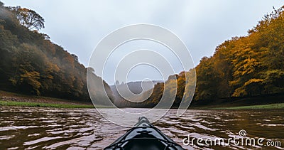 Navigating a kayak on a tranquil river with a large empty space ideal for text and creative elements Stock Photo