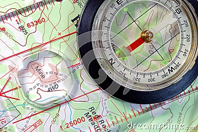 Navigational Compass on Topographical Map Stock Photo