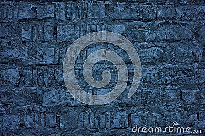 Navy blue old rough brick wall texture. Indigo color messy brickwork. Dark grunge background Stock Photo