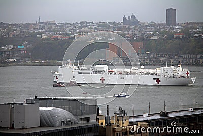 Navy hospital ship Comfort floating through the skyscrapers on the Hudson river Editorial Stock Photo