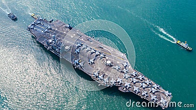 Navy Nuclear Aircraft carrier, Military navy ship carrier full loading fighter jet aircraft, Aerial view Stock Photo